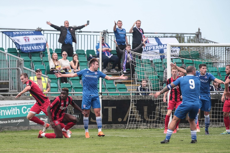 Truro defender Harlain Mbayo handles in the area