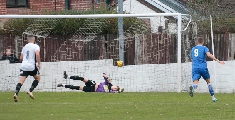 Chance for Henry Spalding as he’s shot hit the post and goes across the goal and to safety