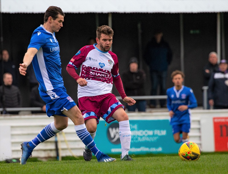 Jake Lee clears the ball away from danger