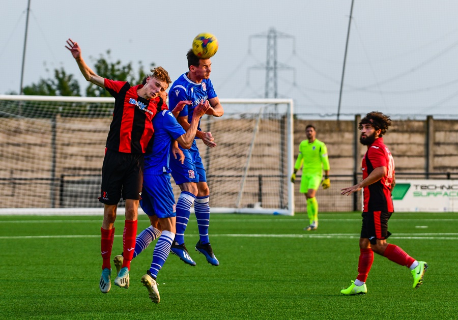 Jake Lee wins the header at Cirencester Town