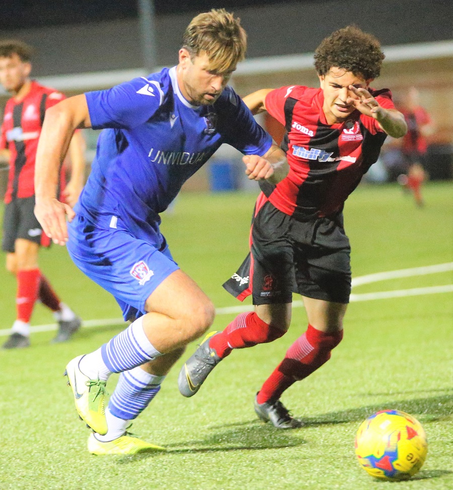 Conor McDonagh runs the Cirencester defender