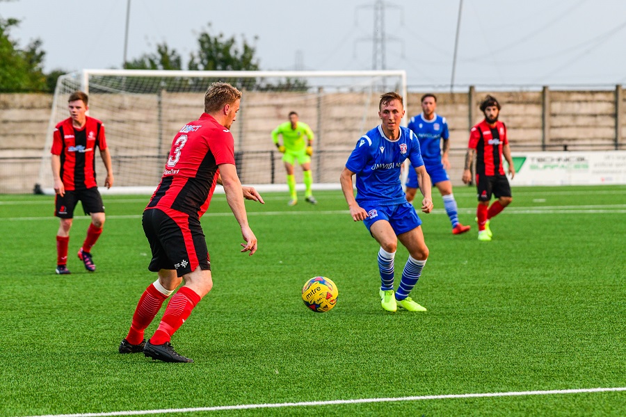 Lee Marshall looks to challenge the Cirencester player