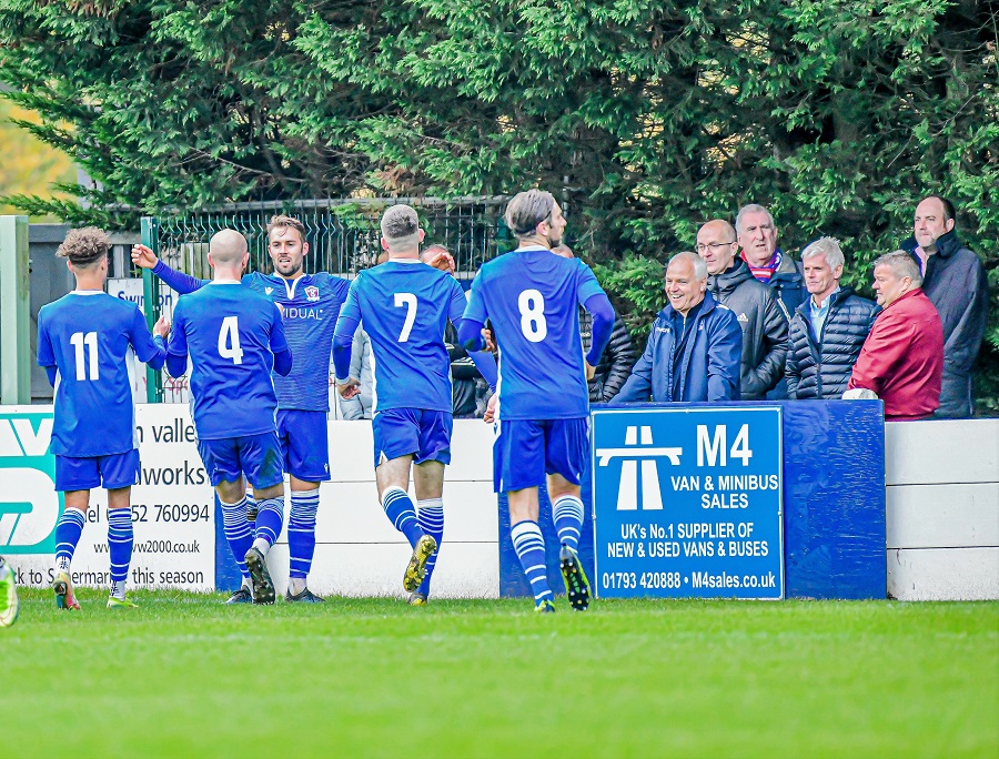 Michael Hopkins’ celebrates the opening goal after his cross was knocked in by Dunstan