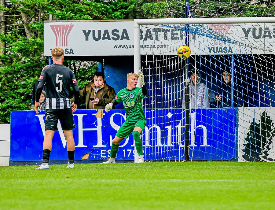 Dorchester defender Dunstan slices the ball into his own net