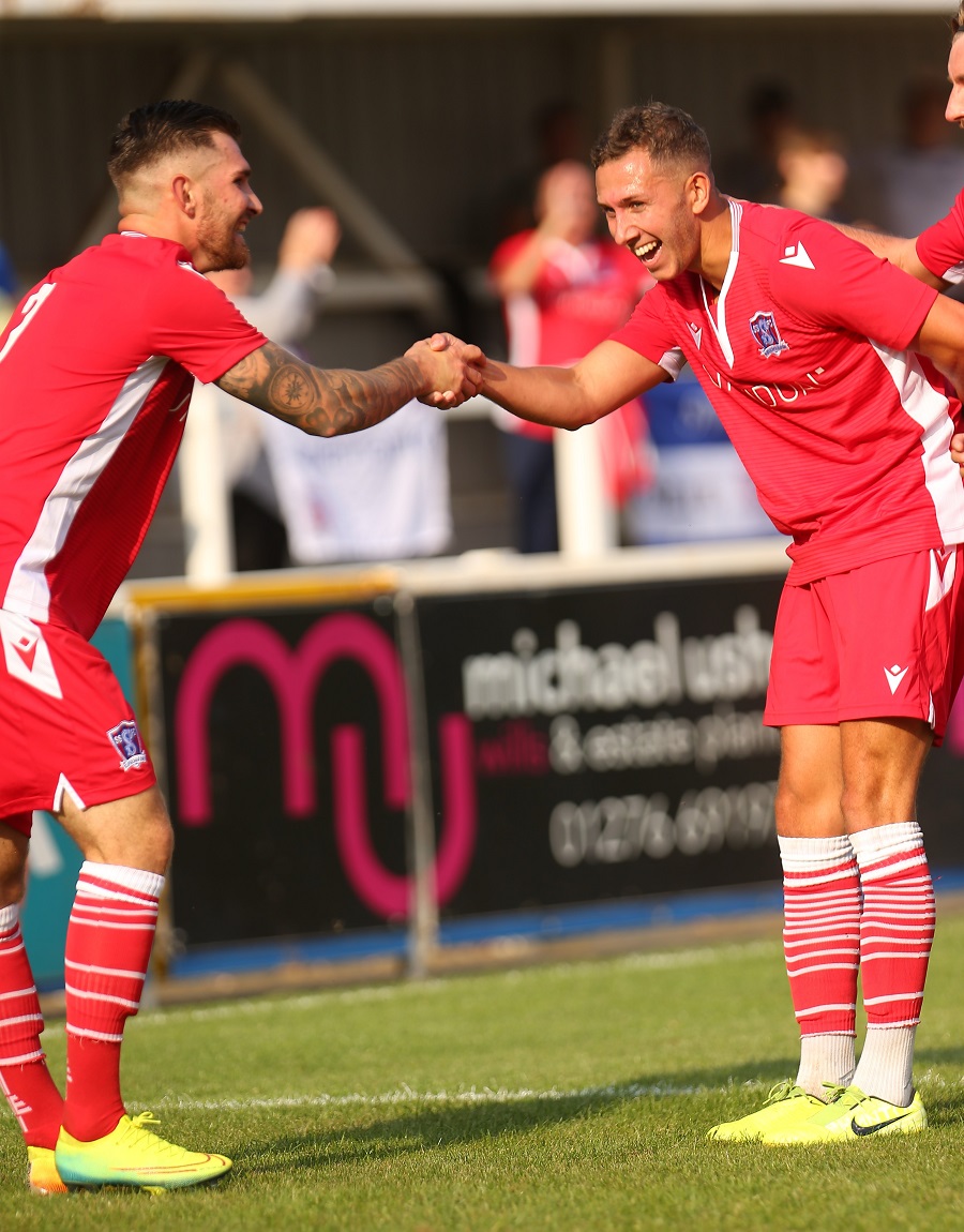 Zack and Harry celebrate with a handshake