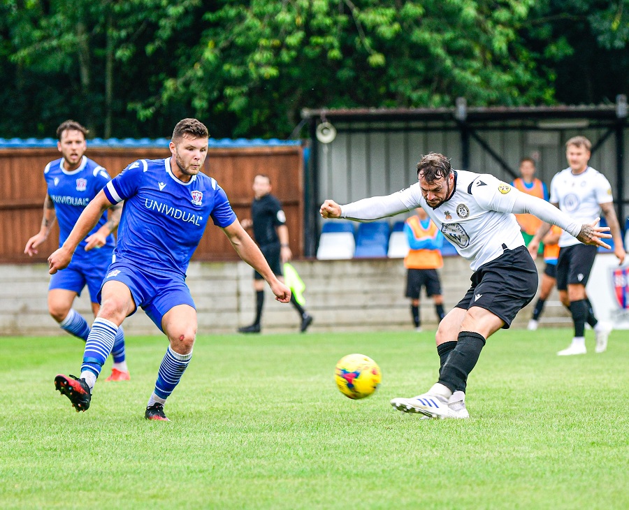 Former Marine player Kyle Tooze shoots for goal