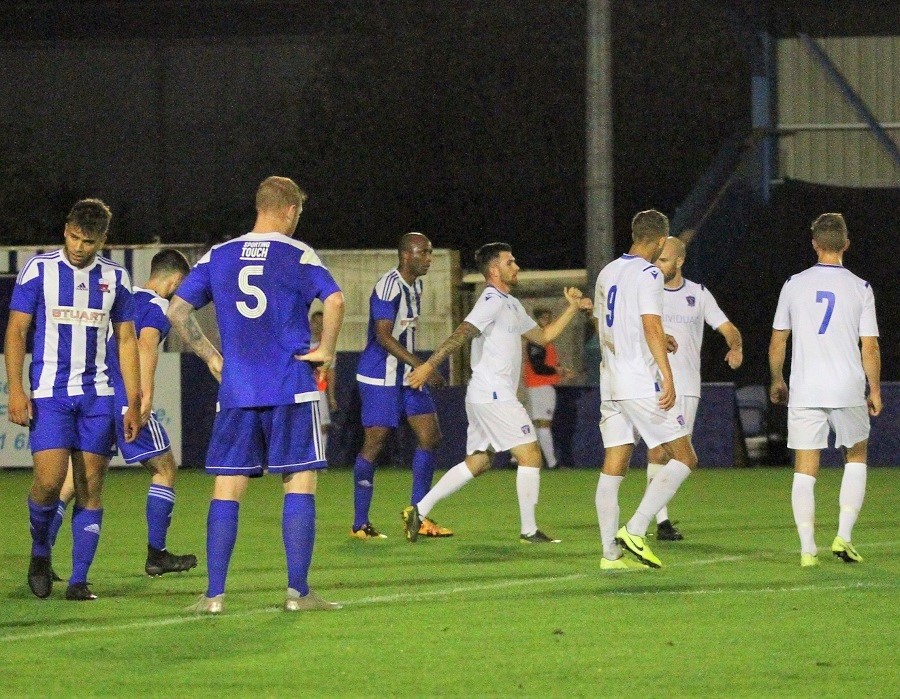 Zack is congratulated by the players