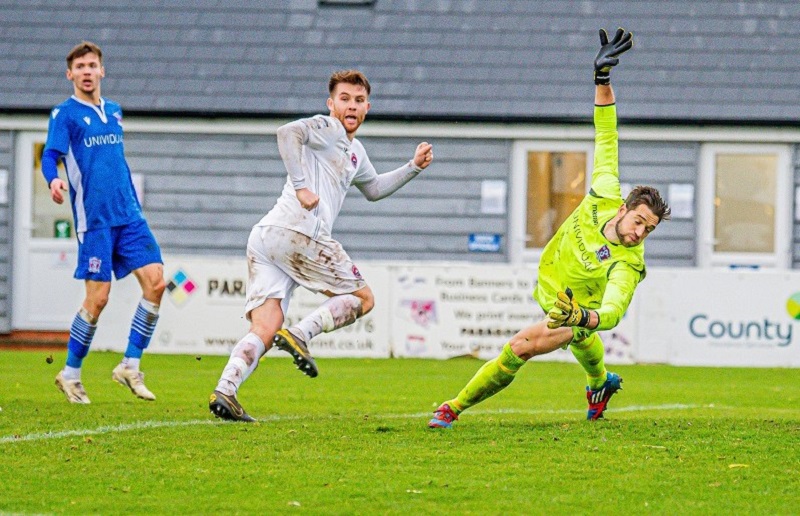 Truro’s Tyler Harvey looks cautiously to the assistant after scoring the late winner