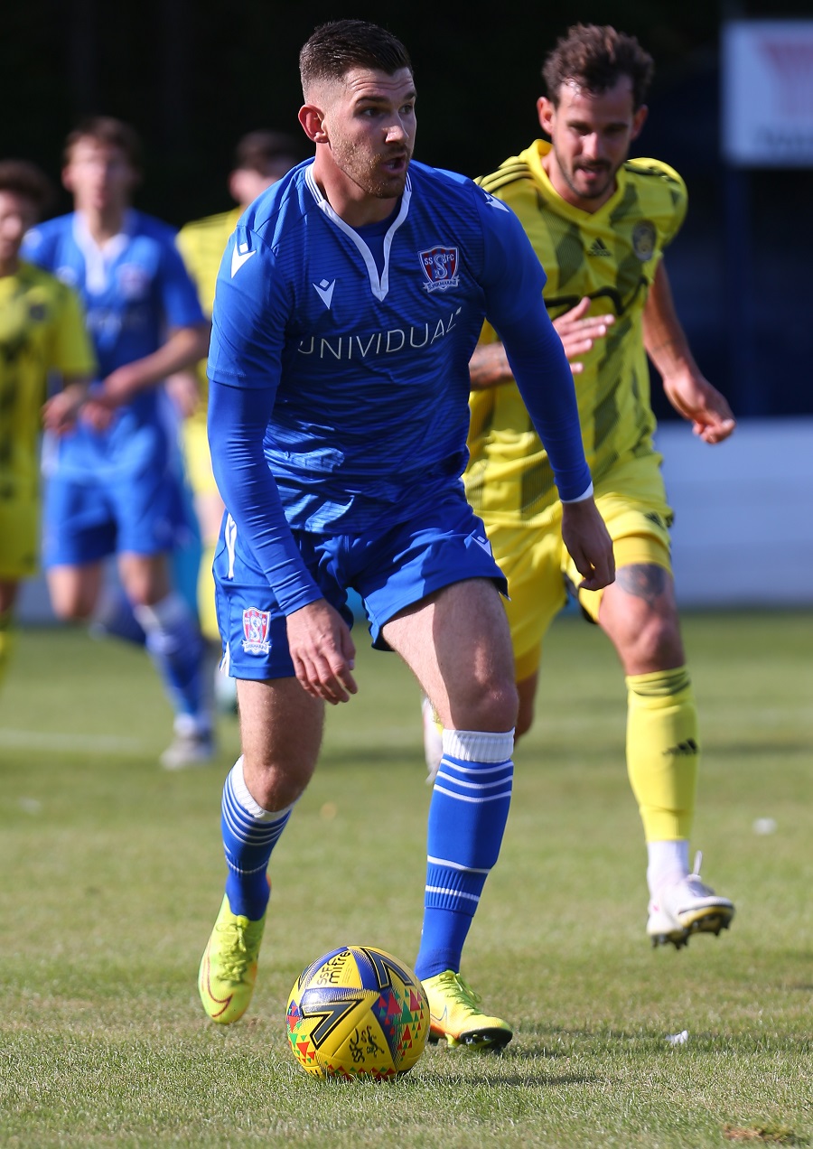 Zack Kotwica goes away from the Tiverton defender