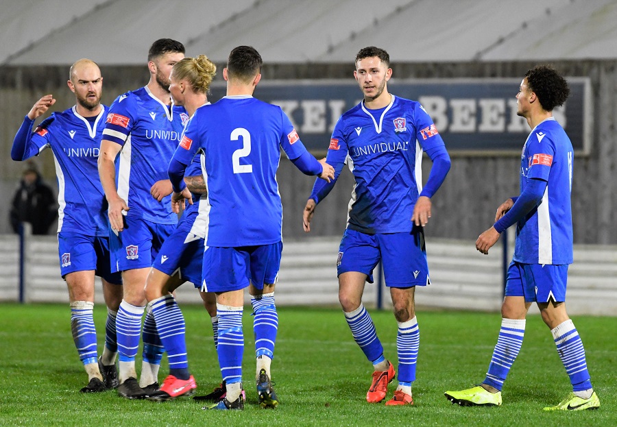 The players celebrate Harry’s goal