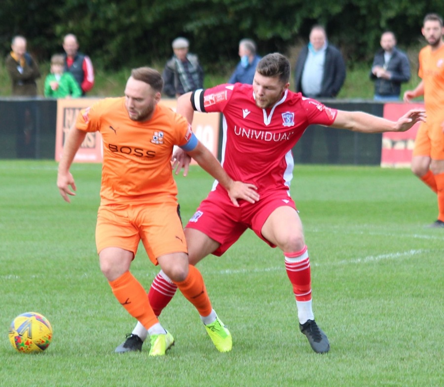 Mat Liddiard challenges for the ball