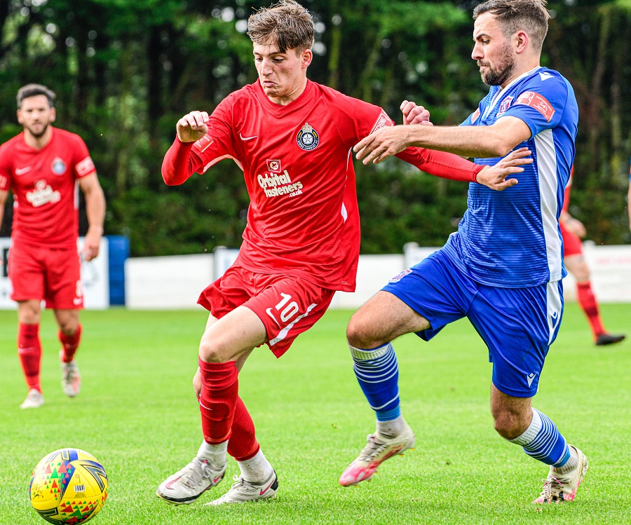 Marine defender Lewis Hall challenges Kings Langley’s Leo Farruch