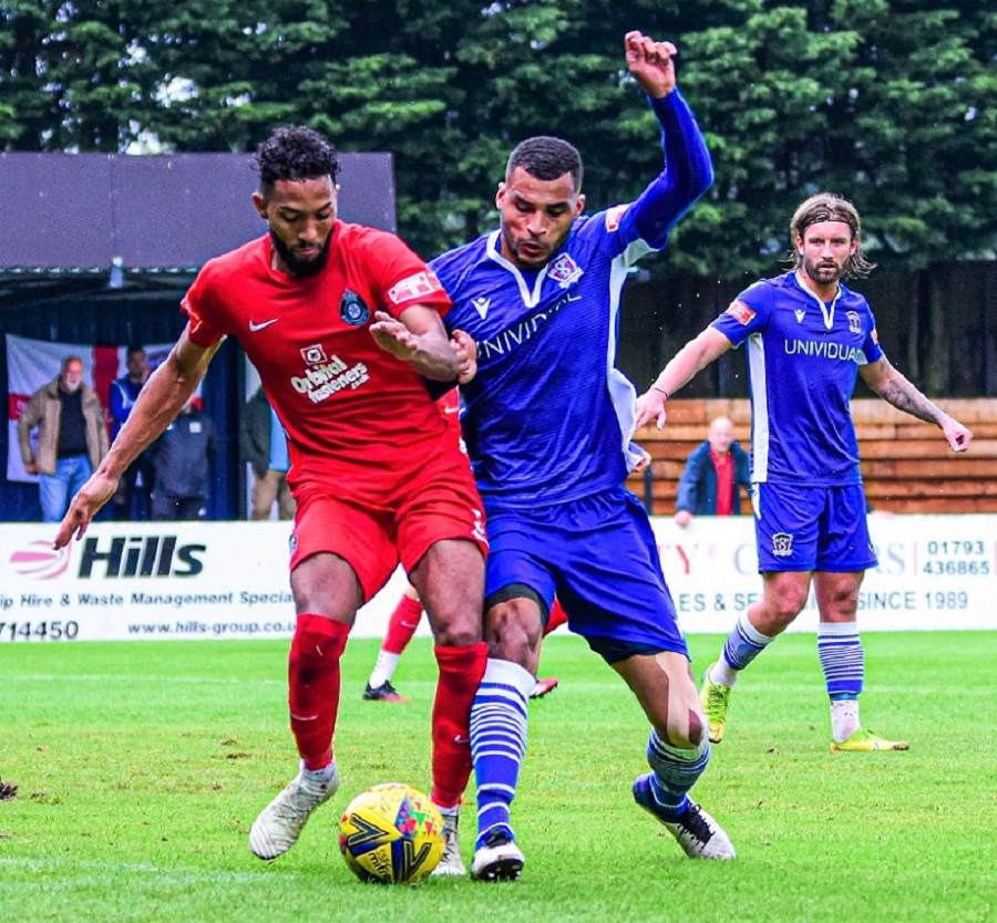 Tyrone Duffus challenges for the ball