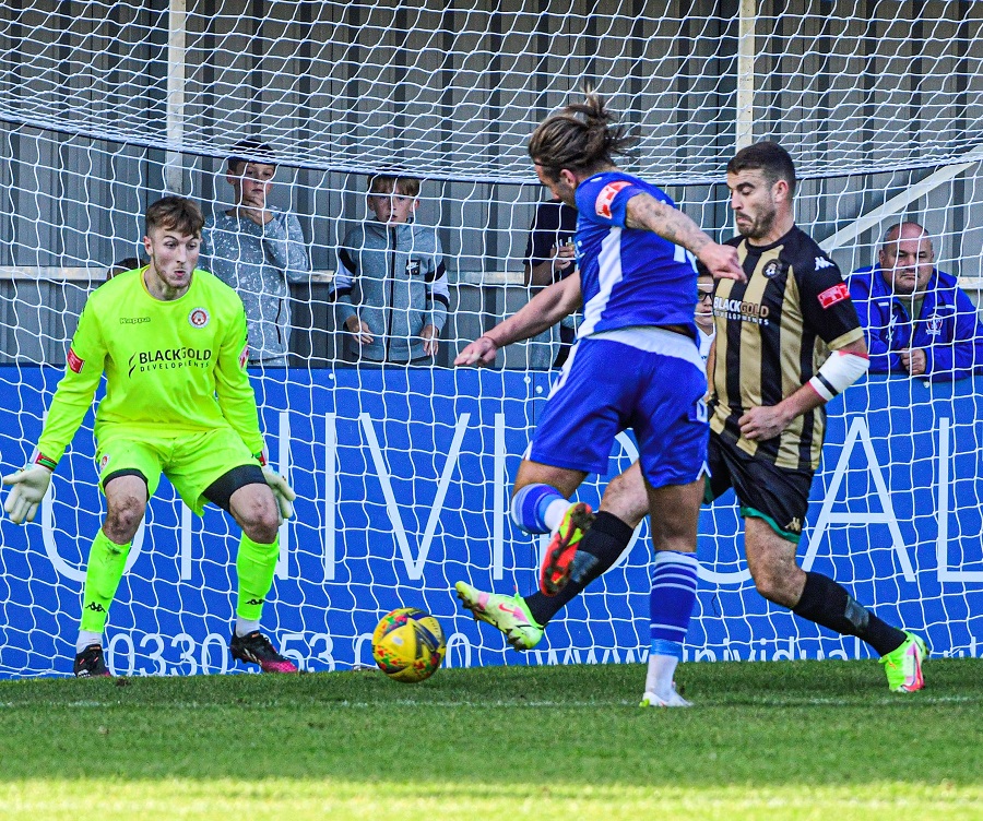 Conor McDonagh’s shot saved by the legs of Alex Rutter