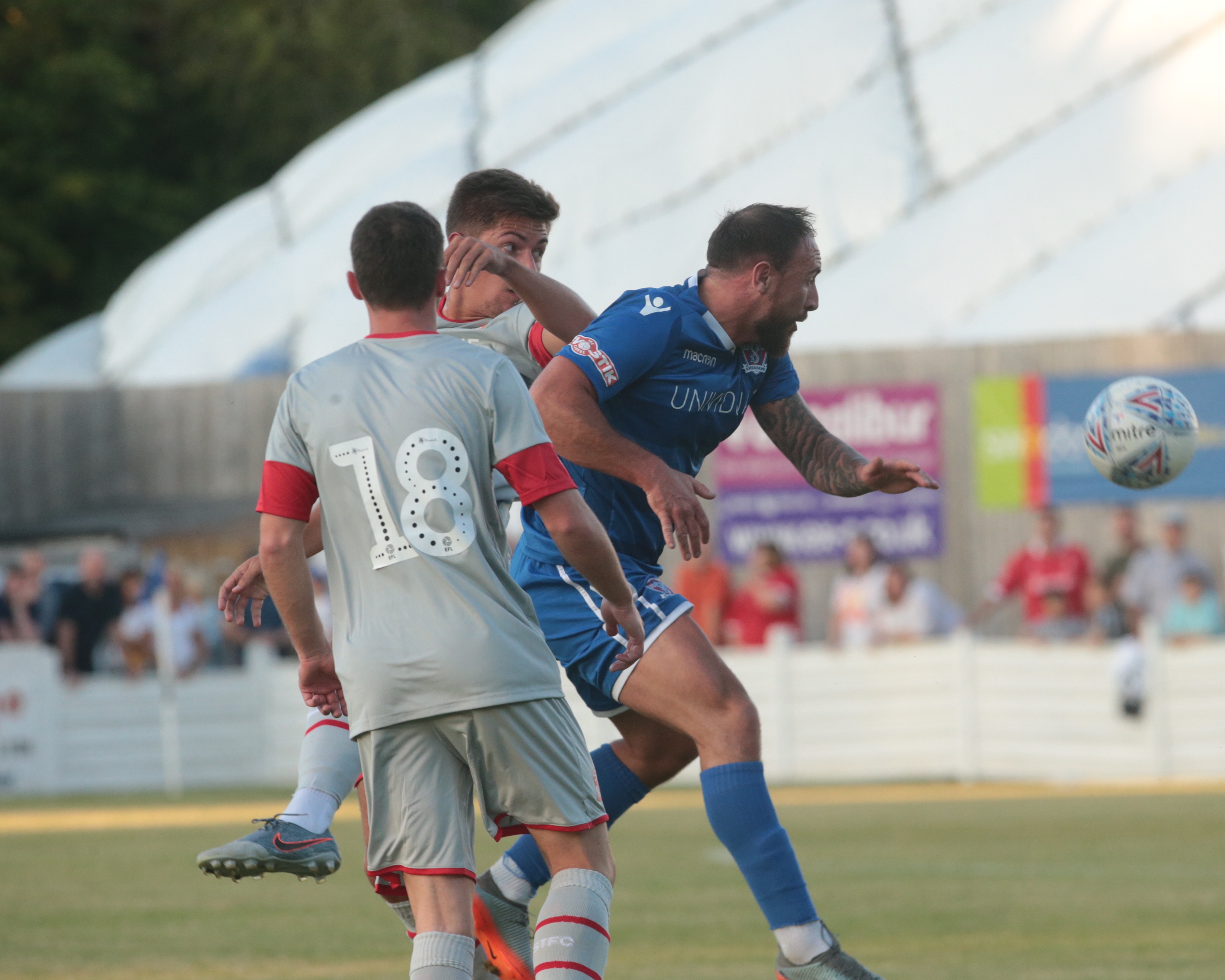 Brad Gray in amongst a couple of Town players