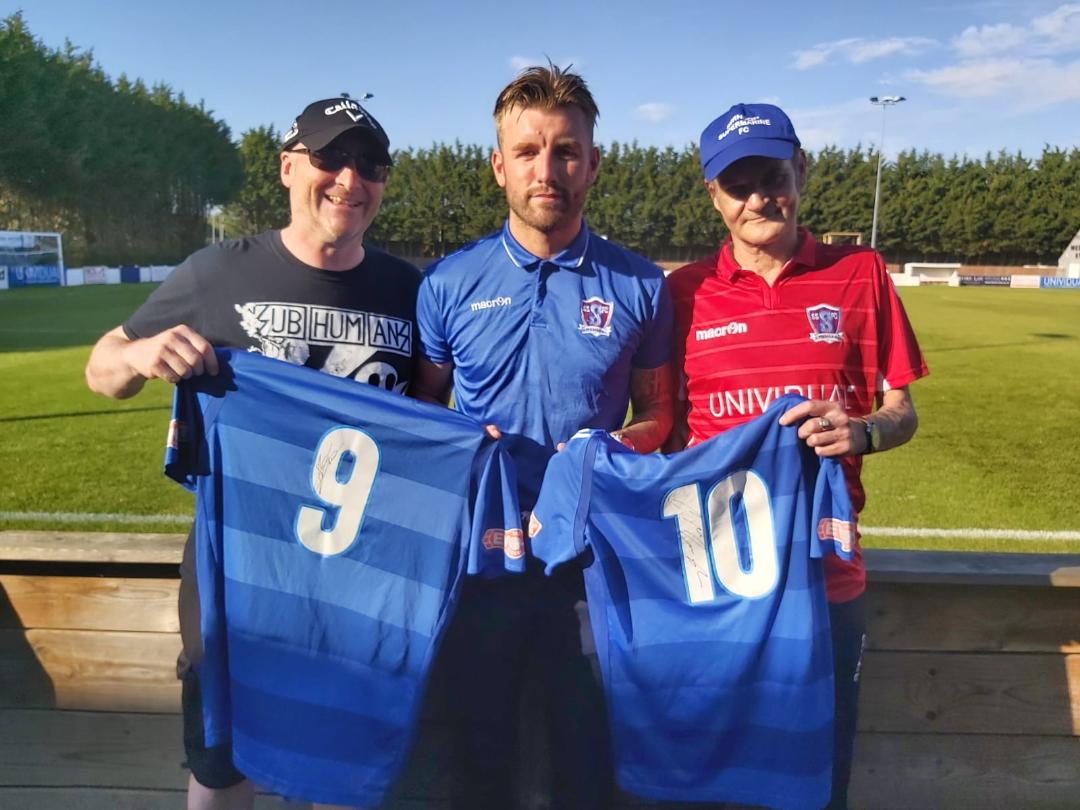 Paul Soakell (AKA Soxy) and Swindon Dave are presented with their shirts by Conor McDonagh.
