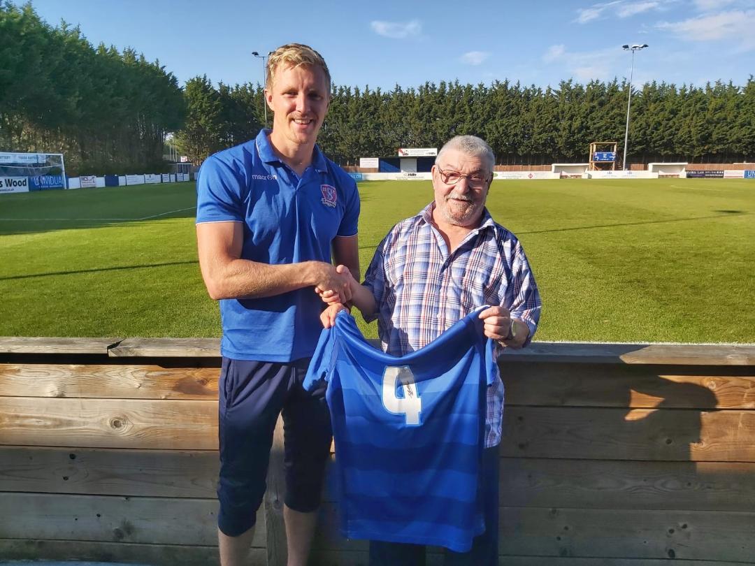 Dave Lewis is presented with his shirt by Joe Shepherd 