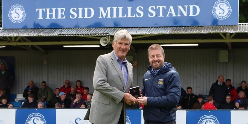 Steve Moore receives an award from the Wilts FA